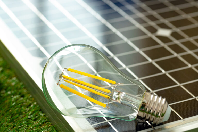 Solar energy panel and light bulb, green energy